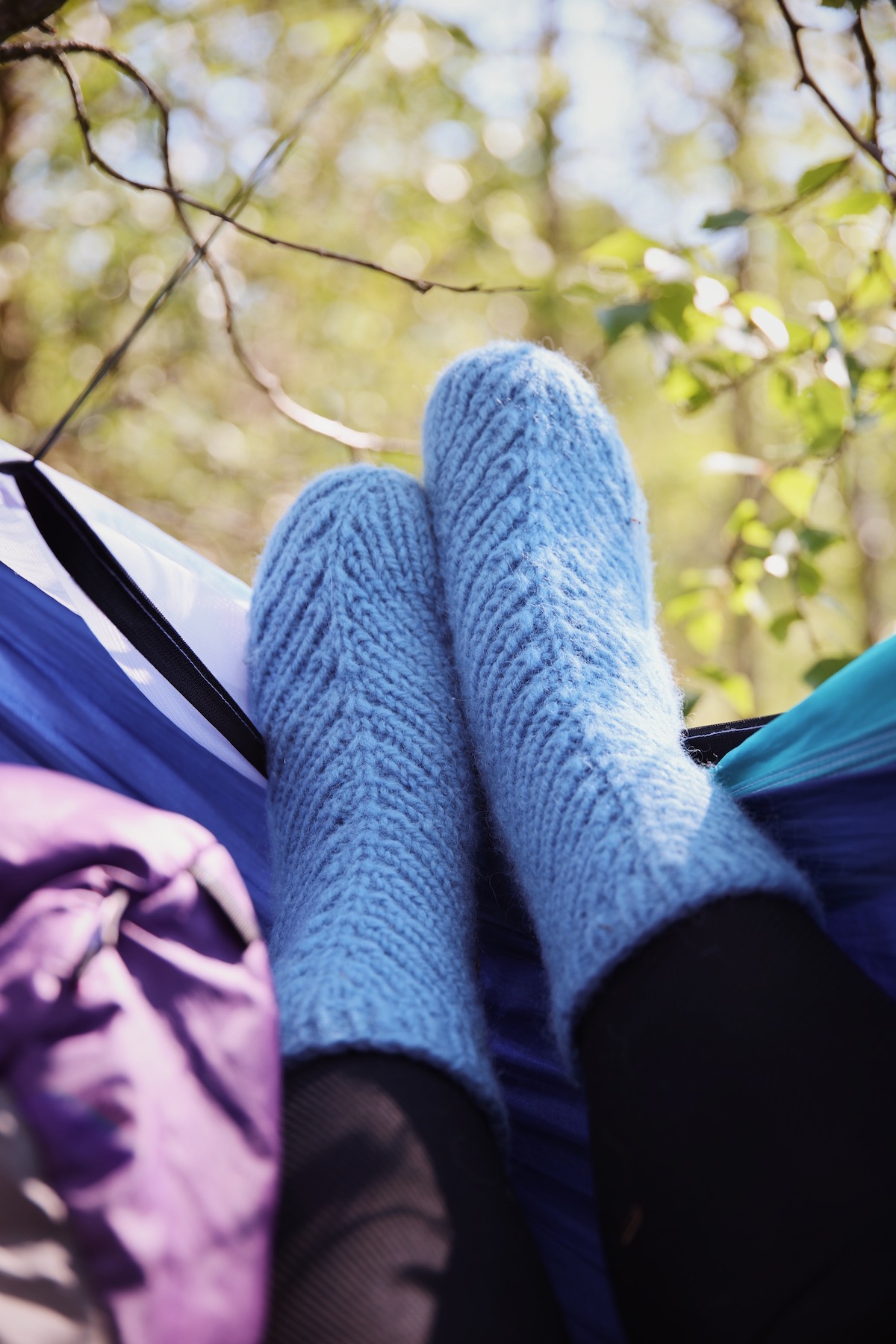 Growing rib socks on feet in a hammock 